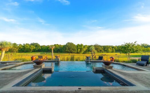 17.44 Acres, 4/4.5 Home w/Pool, 5-Car Garage, 4-Stall Barn, Hay Barn, Free Range Peacocks, Cross Fenced Pastures